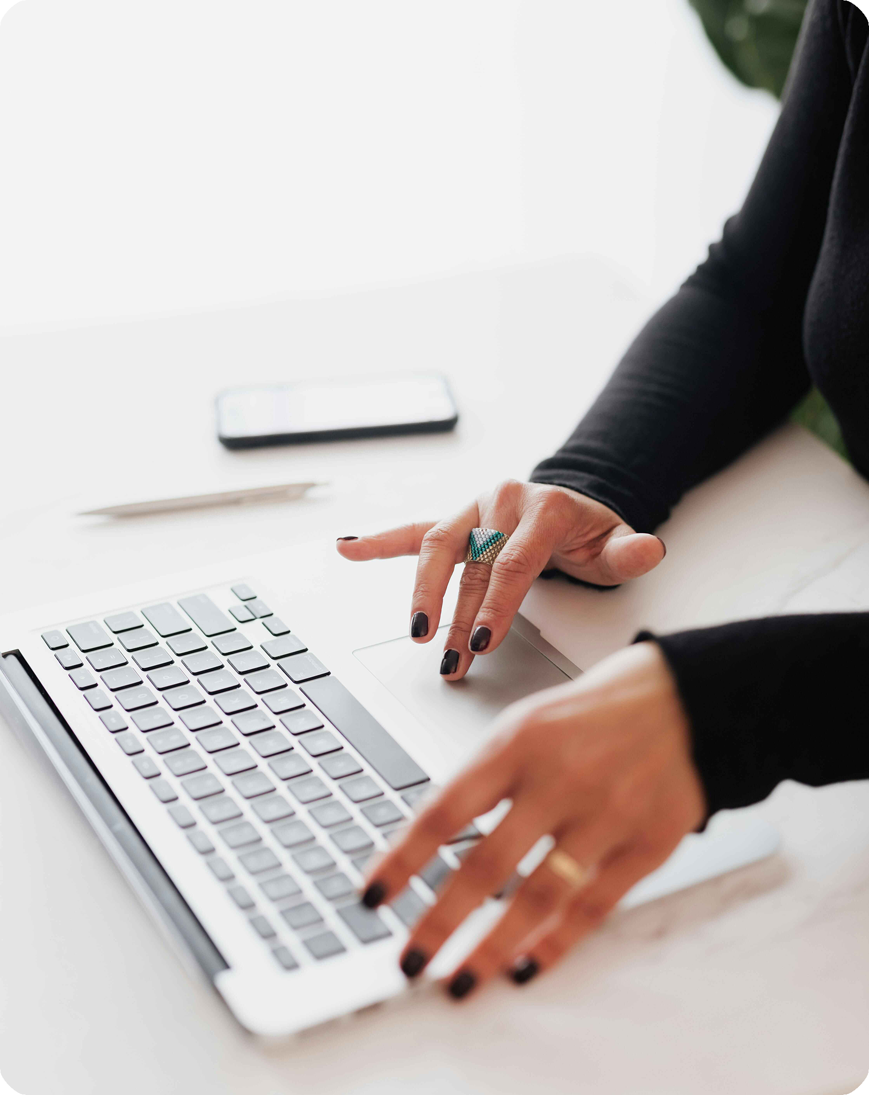 Woman typing on keyboard, connected to WiFi in her apartment