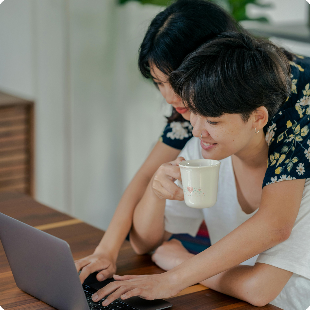 Couple signing up on their computer